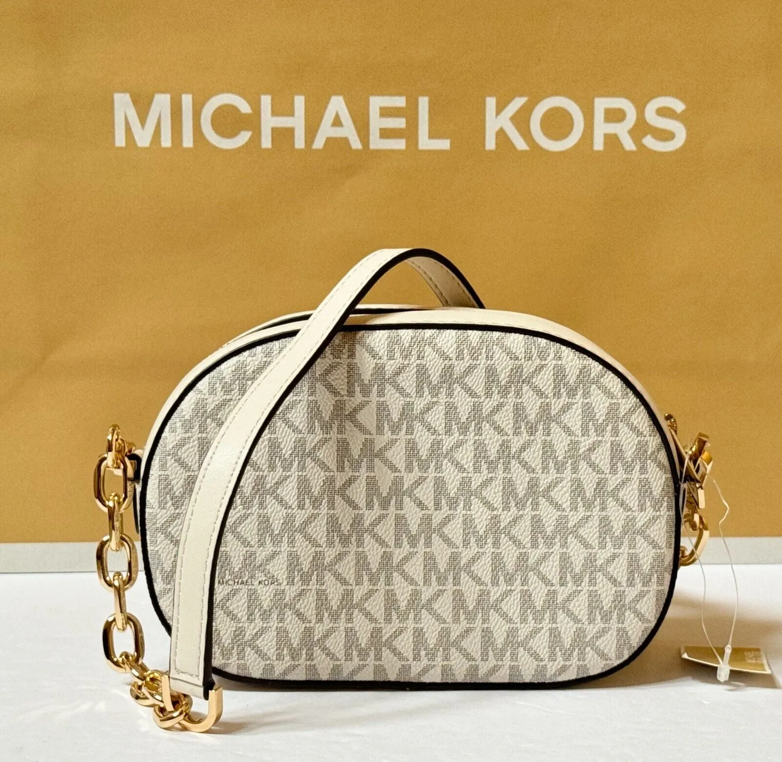 MICHAEL KORS JET SET GLAM SMALL FRONT POCKET OVAL CROSSBODY BAG MK LIGHT CREAM